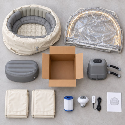 Winter Edition hot tub set unboxed — spa, clear dome, step, heater pump, thermal covers, filter, dispenser, remote and manual