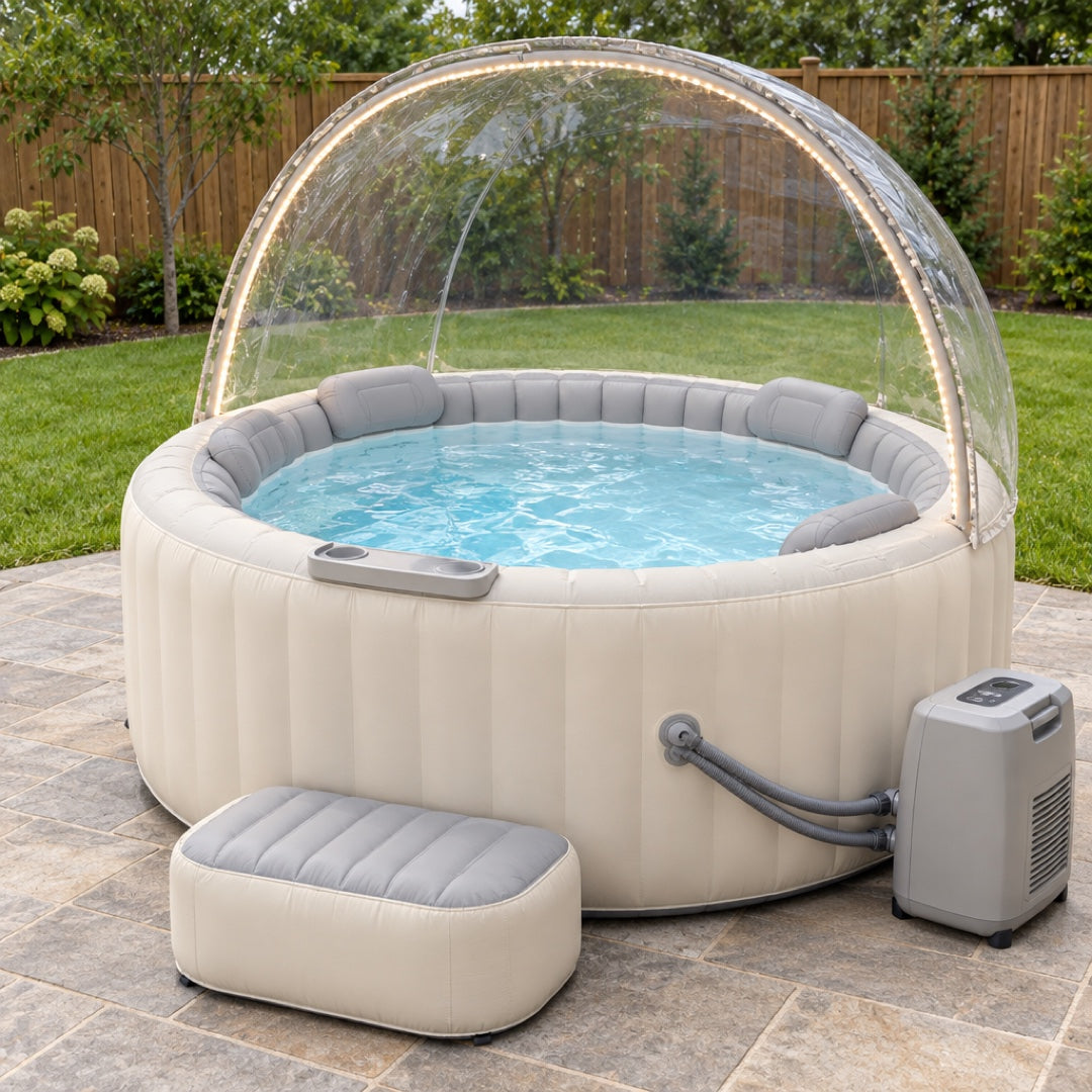 Winter Edition inflatable hot tub in daylight — clear dome canopy with LED strip, headrests, drink ledge, step and heater pump